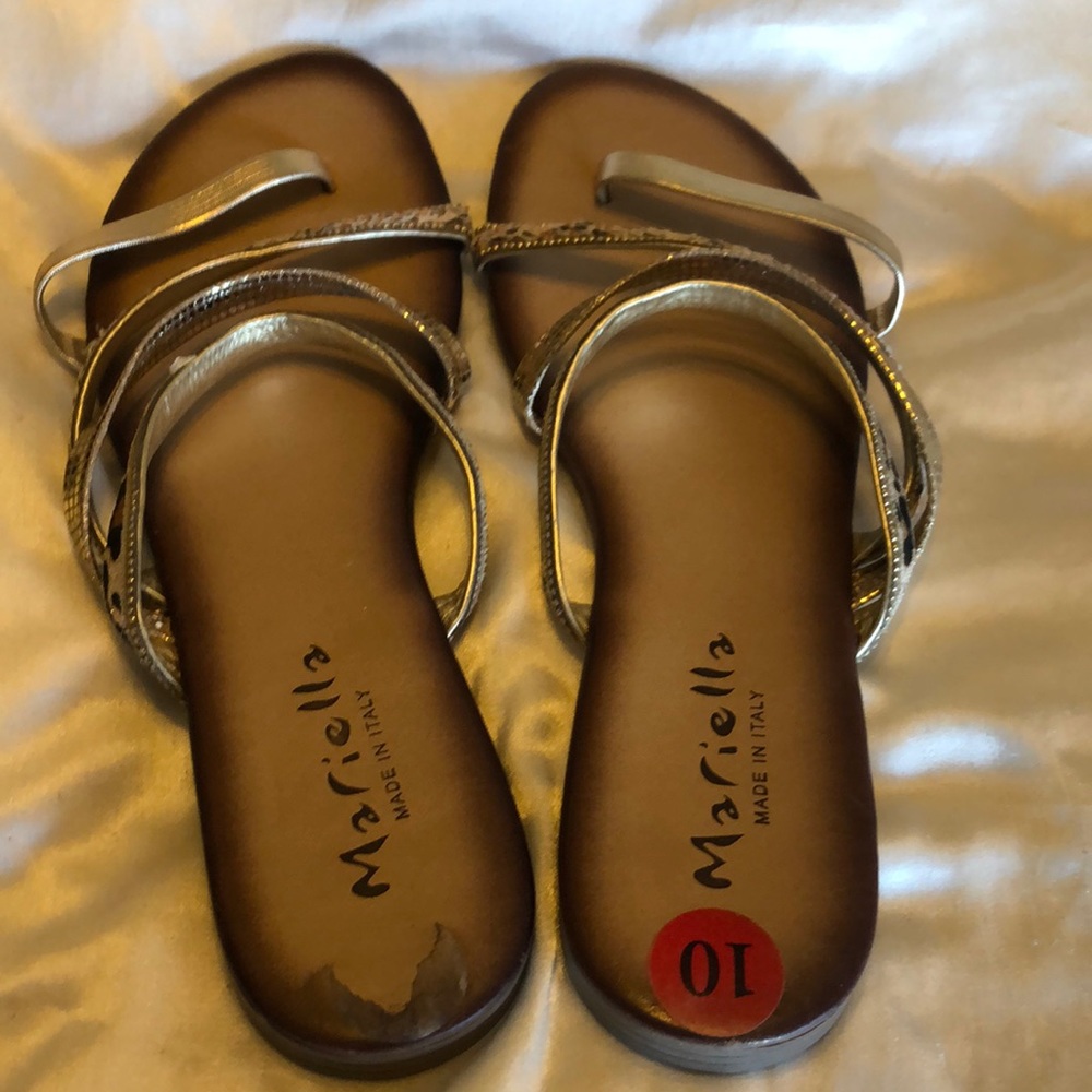 Used sandals size lo with animal print good condition